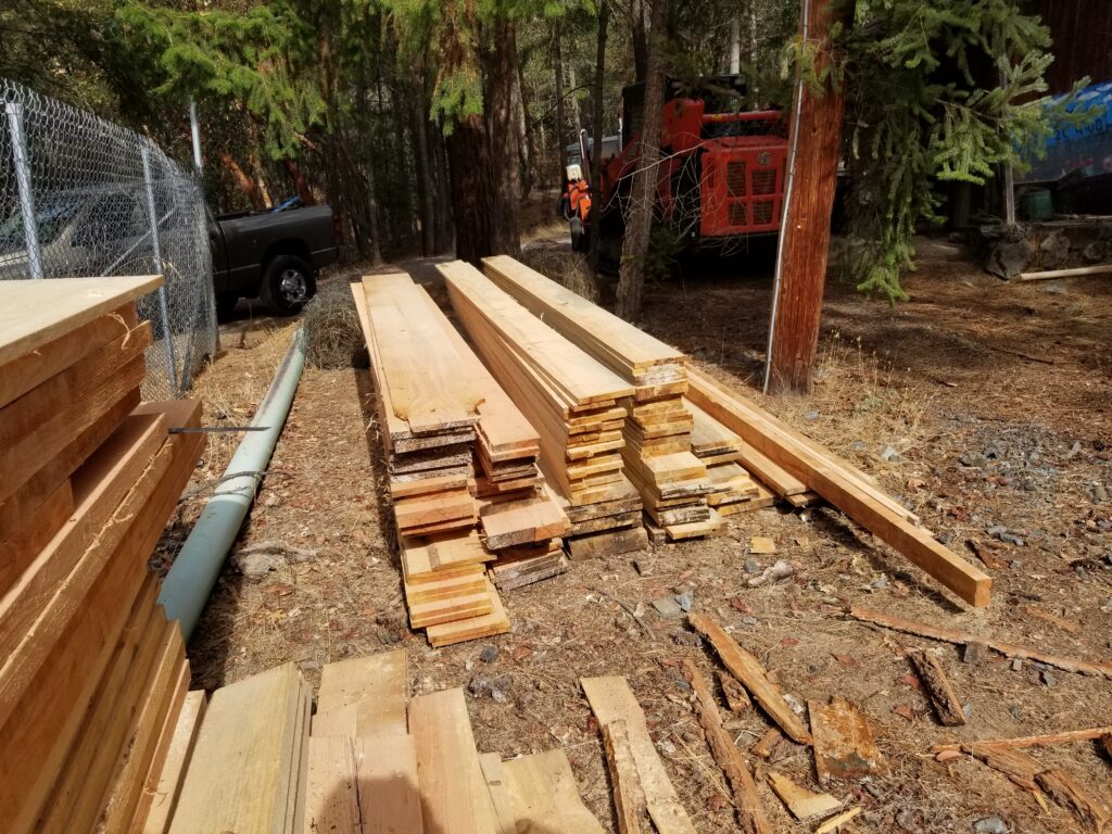 Stacked lumber from a milling project in Ruch.