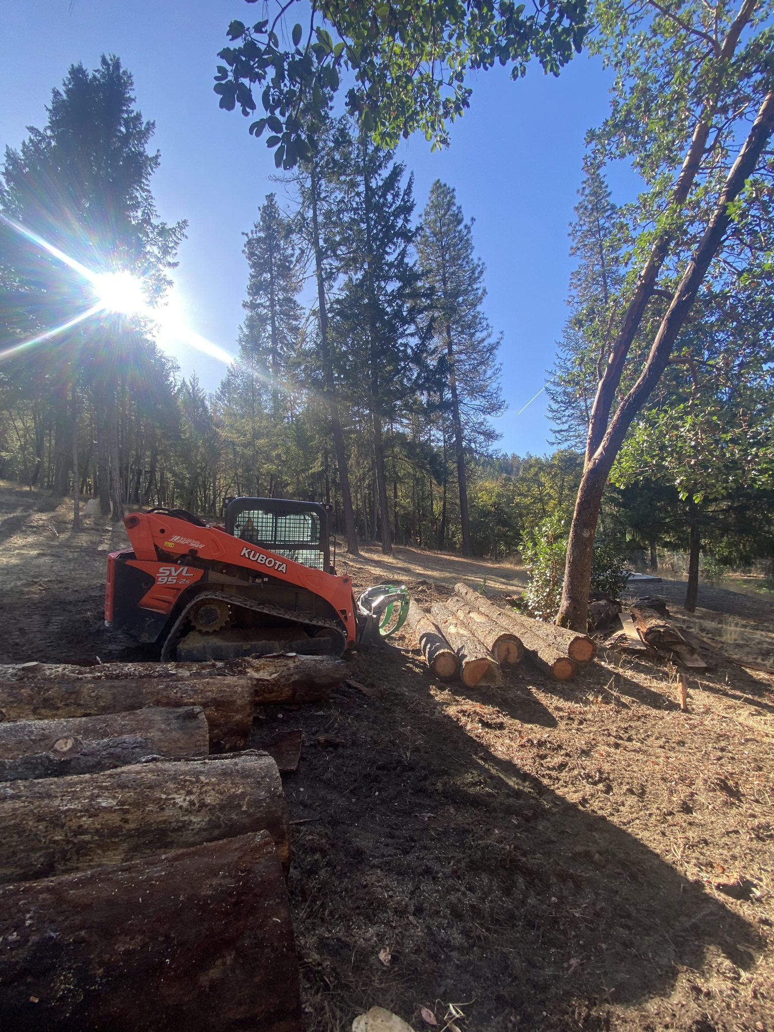 Kubota skid-steer, mobile milling, shallow hole drilling for concrete forms using the auger. Moving downed trees and stacking the.